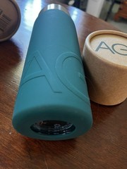 AG1 The Glass Shaker 16 fl oz Glass Bottle Green Sleeve Screw-On Lid, Marks