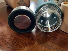 AG1 The Glass Shaker 16 fl oz Glass Bottle Green Sleeve Screw-On Lid, Marks