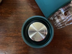 AG1 The Glass Shaker 16 fl oz Glass Bottle Green Sleeve Screw-On Lid, Marks